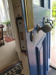 repairing a damaged door lock in Holywood