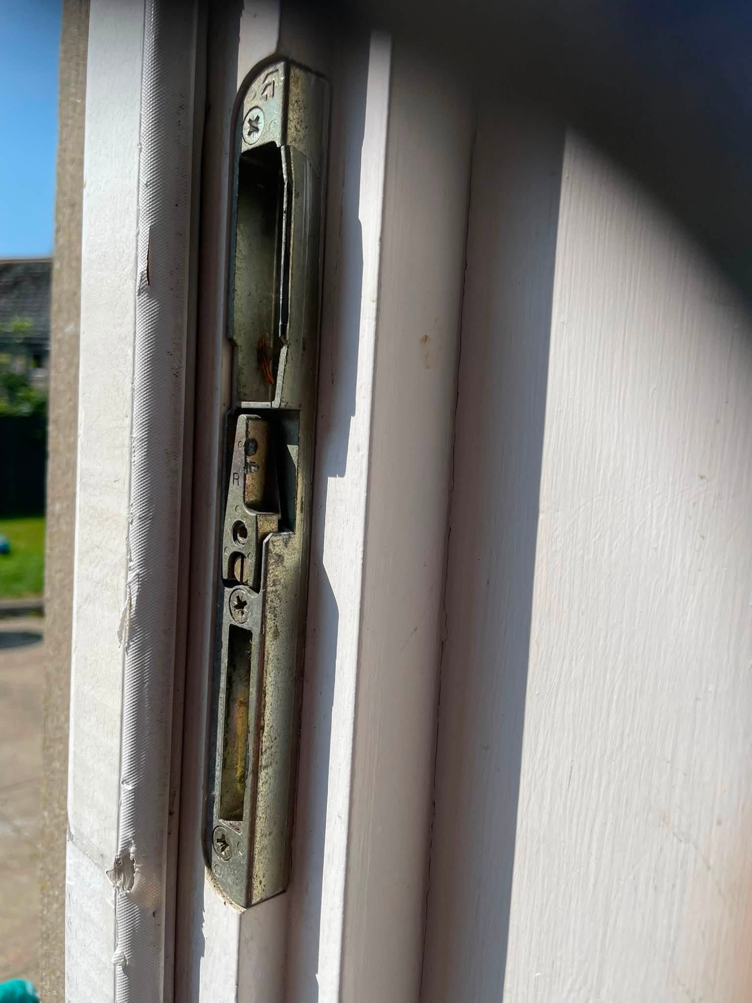Locksmith repairing damaged door locks in Antrim