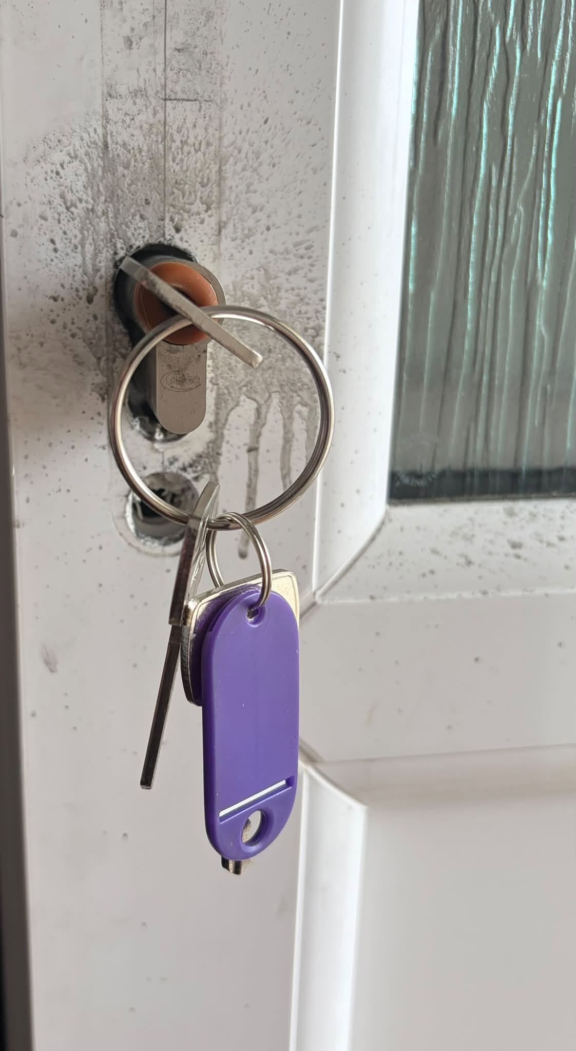 Locksmith repairing damaged door locks in Holywood