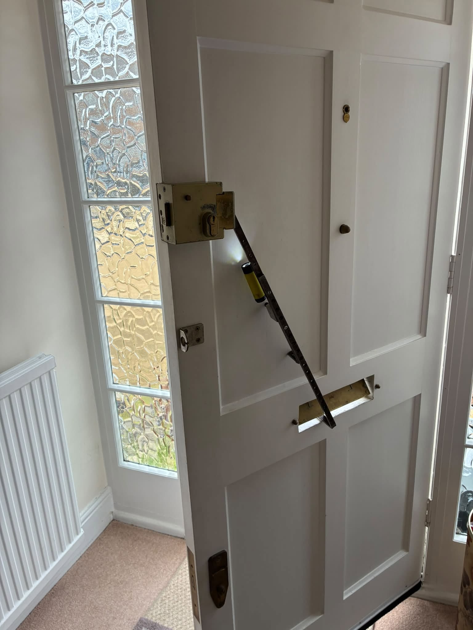 Locksmith repairing damaged door locks in Newtownards